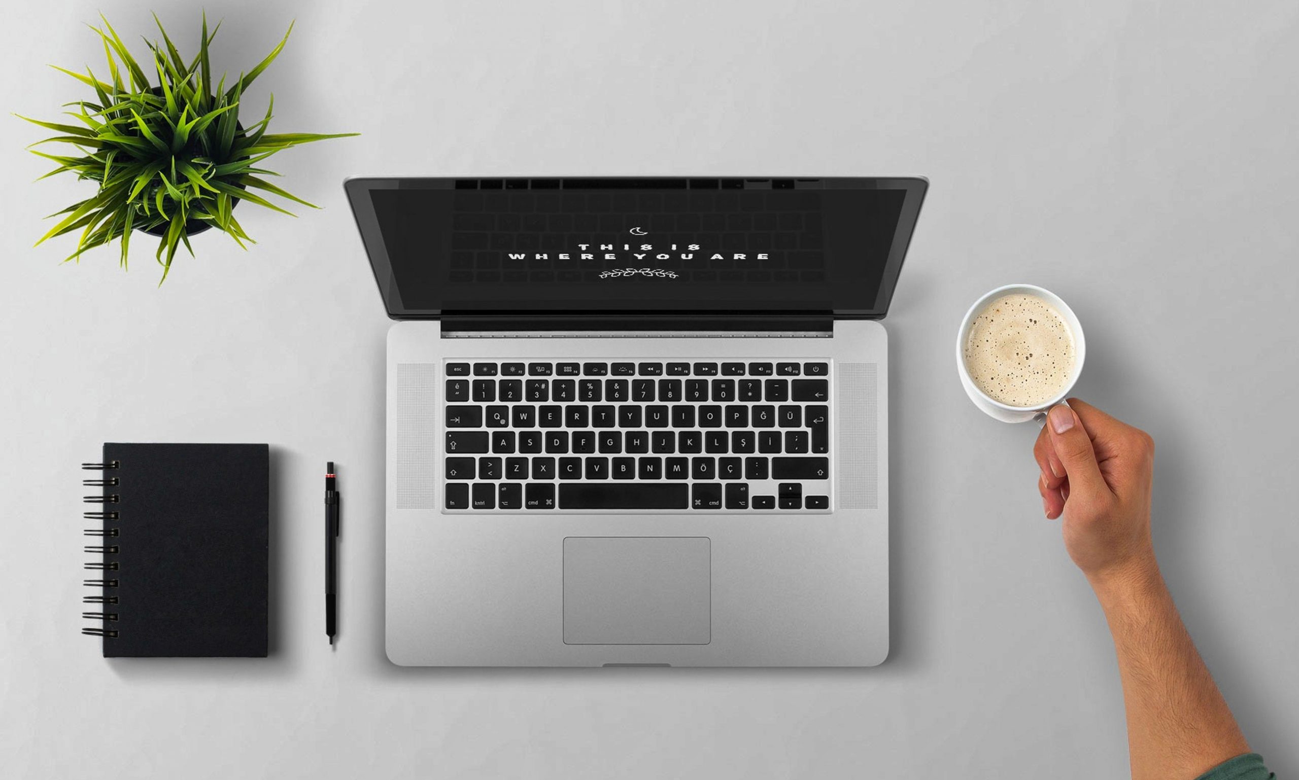 man-using-laptop-on-table-against-white-background-257897